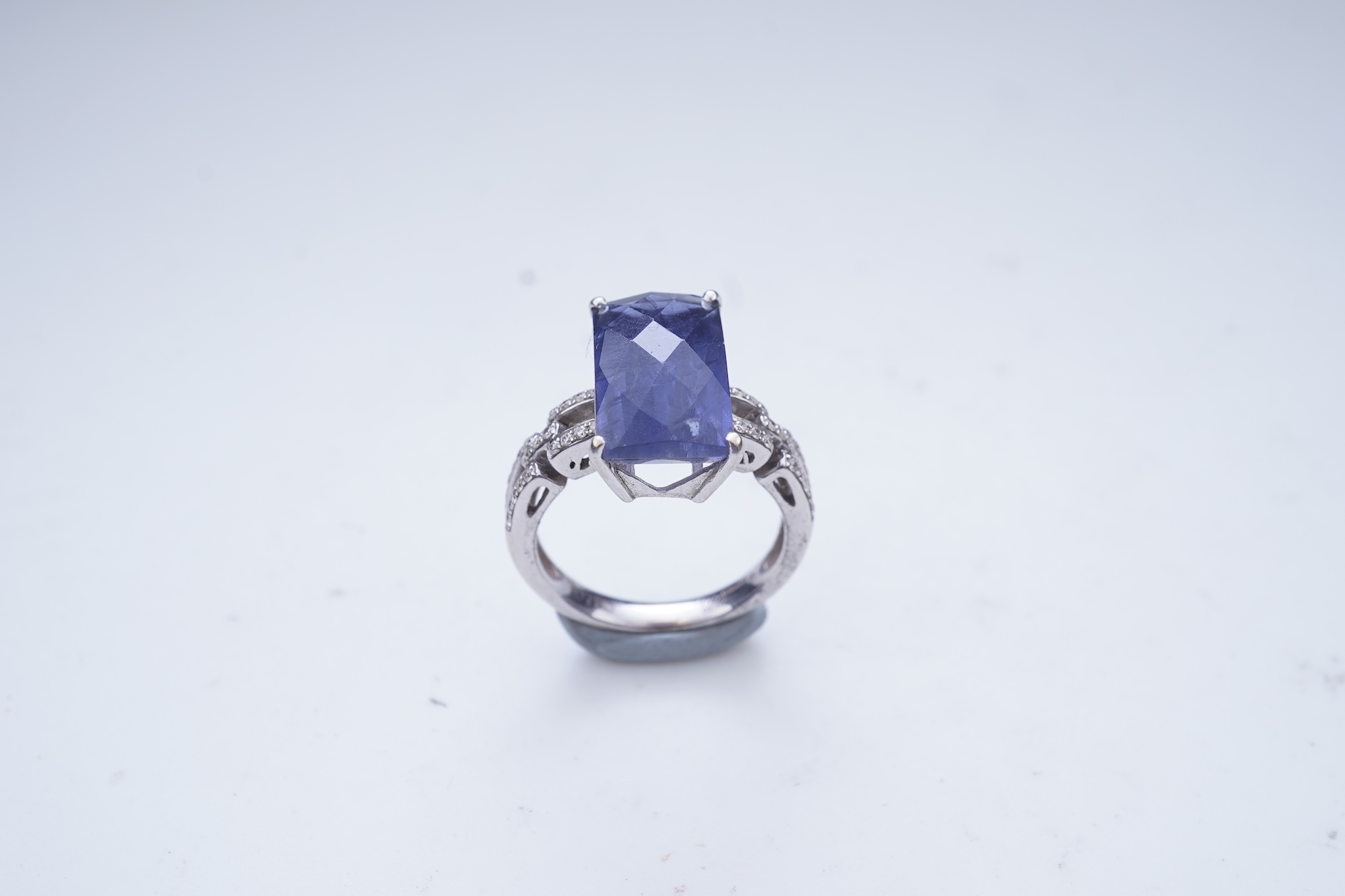 An iolite and diamond ring